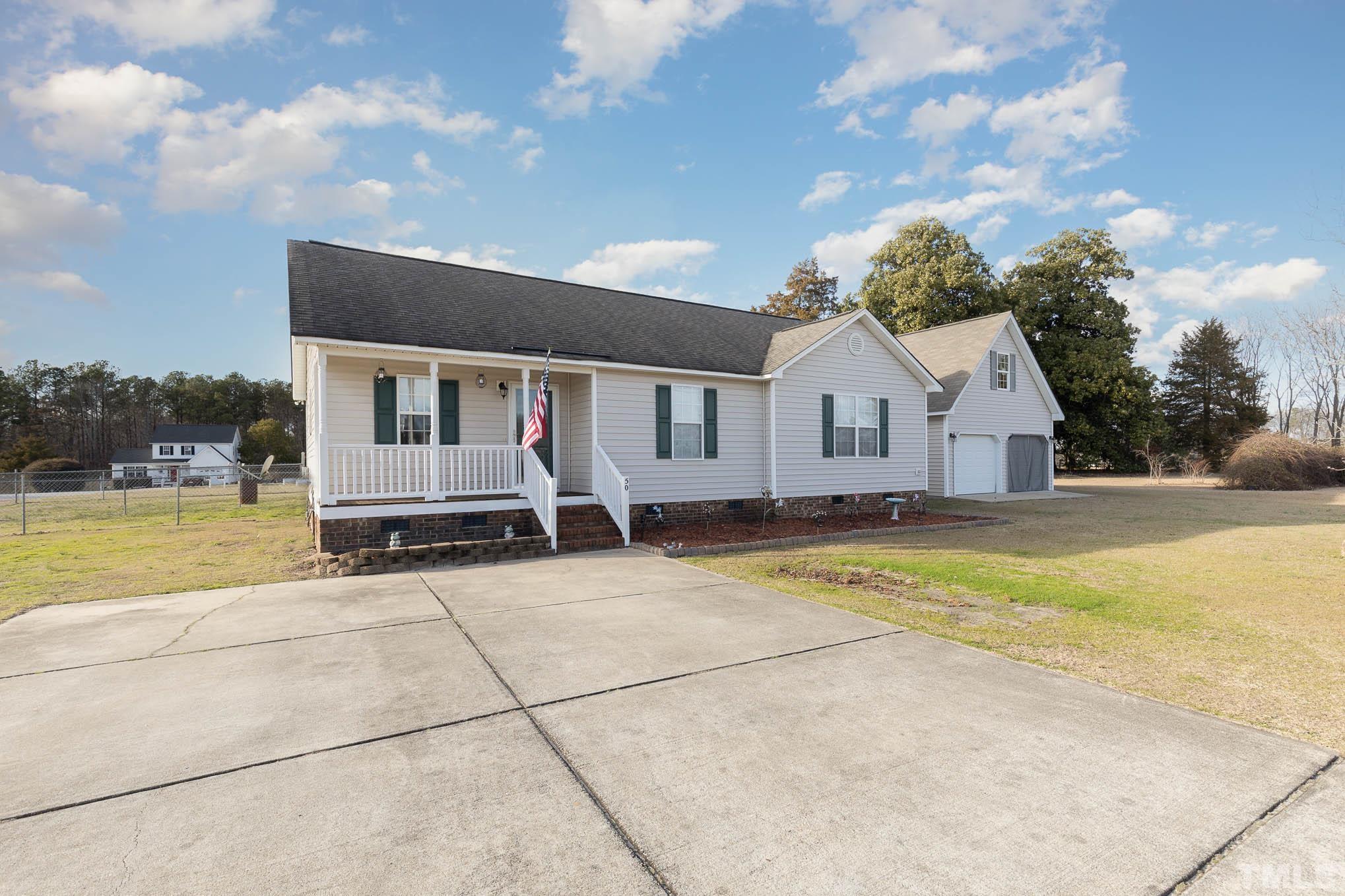 50 Wagner Road Willow Spring, NC 27592 - Photo 2 of 18 a view of house with swimming pool and yard