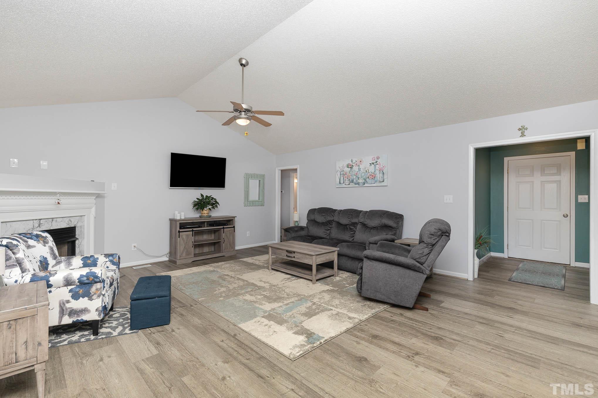 50 Wagner Road Willow Spring, NC 27592 - Photo 4 of 18 a living room with furniture and a flat screen tv