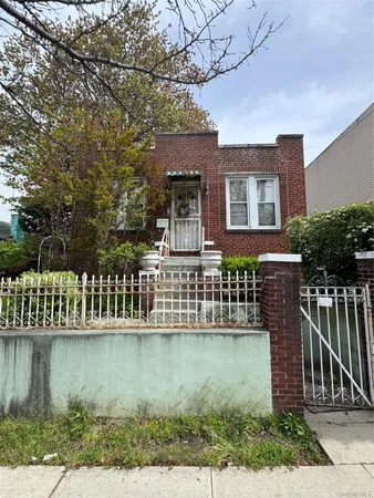 a view of a house with a wooden deck