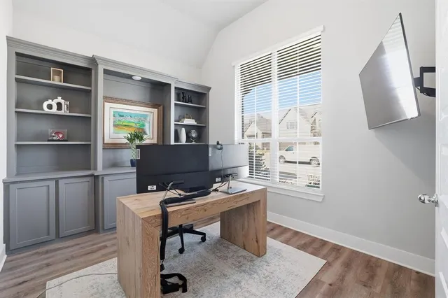 a workspace with furniture and window