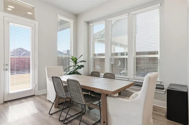 a view of a dining room with furniture and window