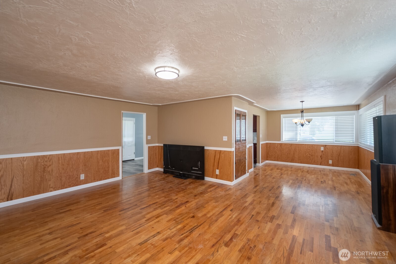 11627 Rd K Northeast Moses Lake, WA 98837 - Photo 11 of 37 a view of a livingroom with wooden floor