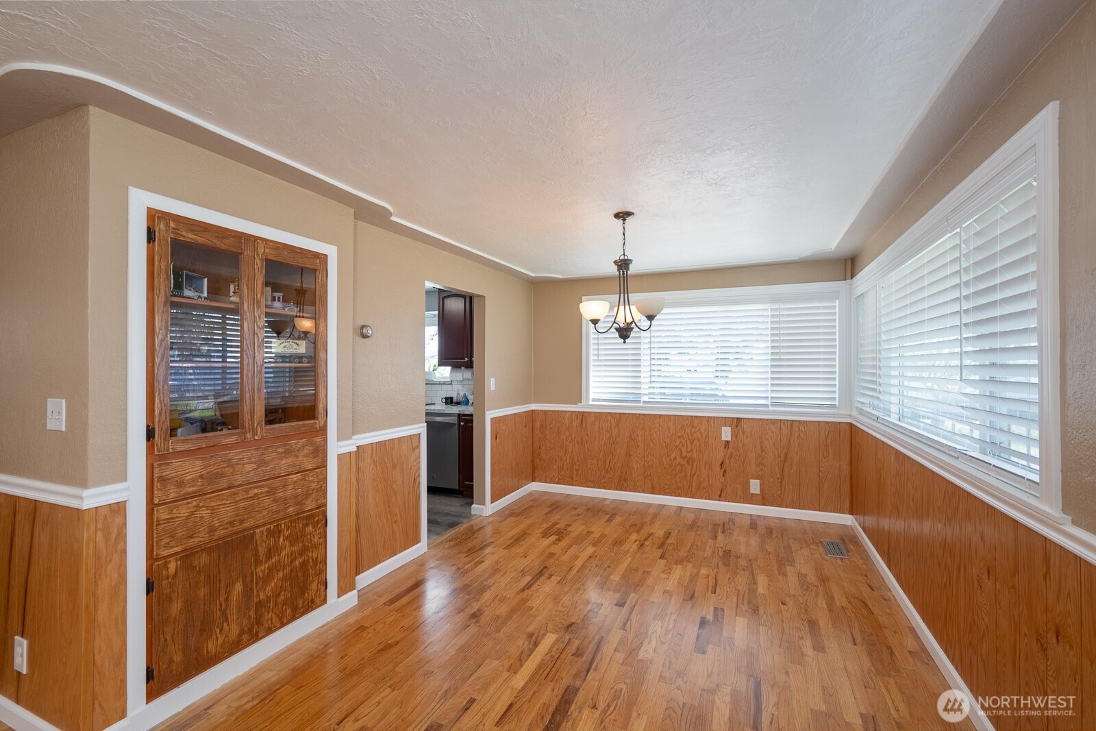 11627 Rd K Northeast Moses Lake, WA 98837 - Photo 13 of 37 a view of kitchen with wooden floor and window