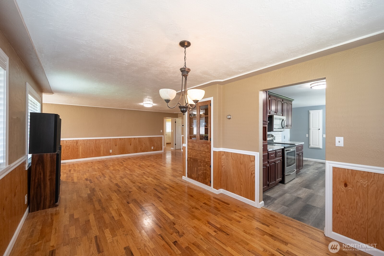 11627 Rd K Northeast Moses Lake, WA 98837 - Photo 14 of 37 a view of a kitchen with wooden floor and a kitchen