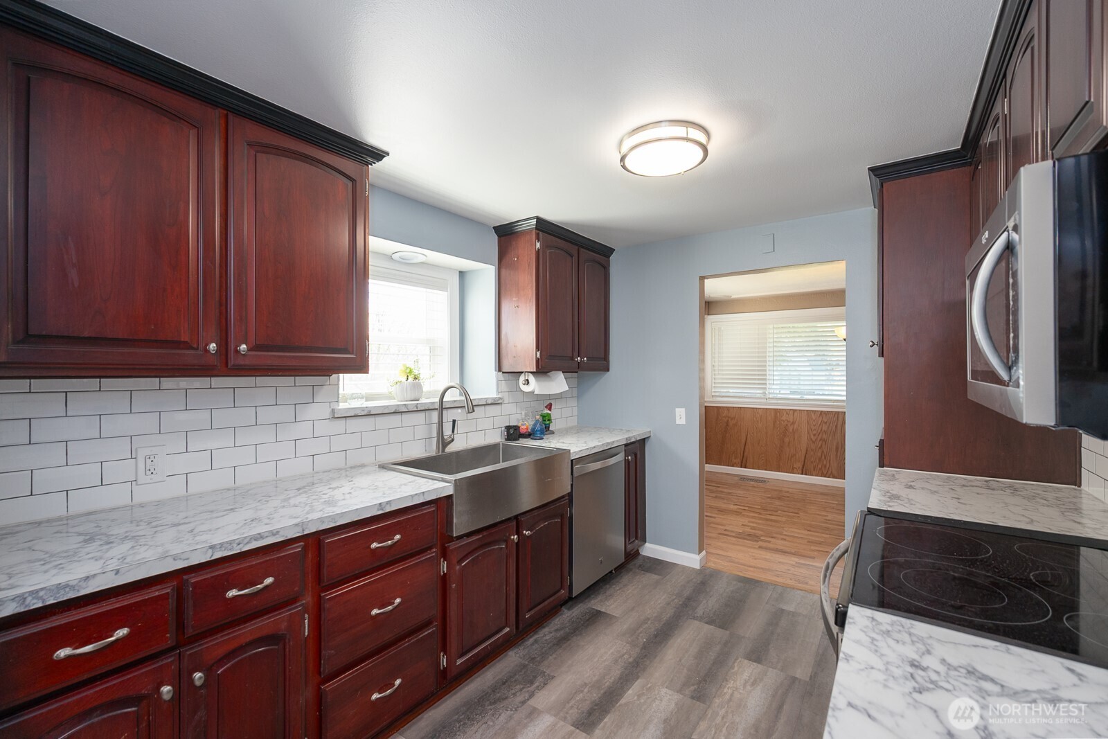 11627 Rd K Northeast Moses Lake, WA 98837 - Photo 17 of 37 a kitchen with stainless steel appliances granite countertop a sink stove and cabinets