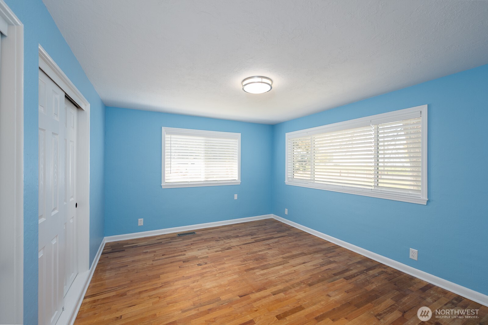 11627 Rd K Northeast Moses Lake, WA 98837 - Photo 22 of 37 a view of empty room with wooden floor