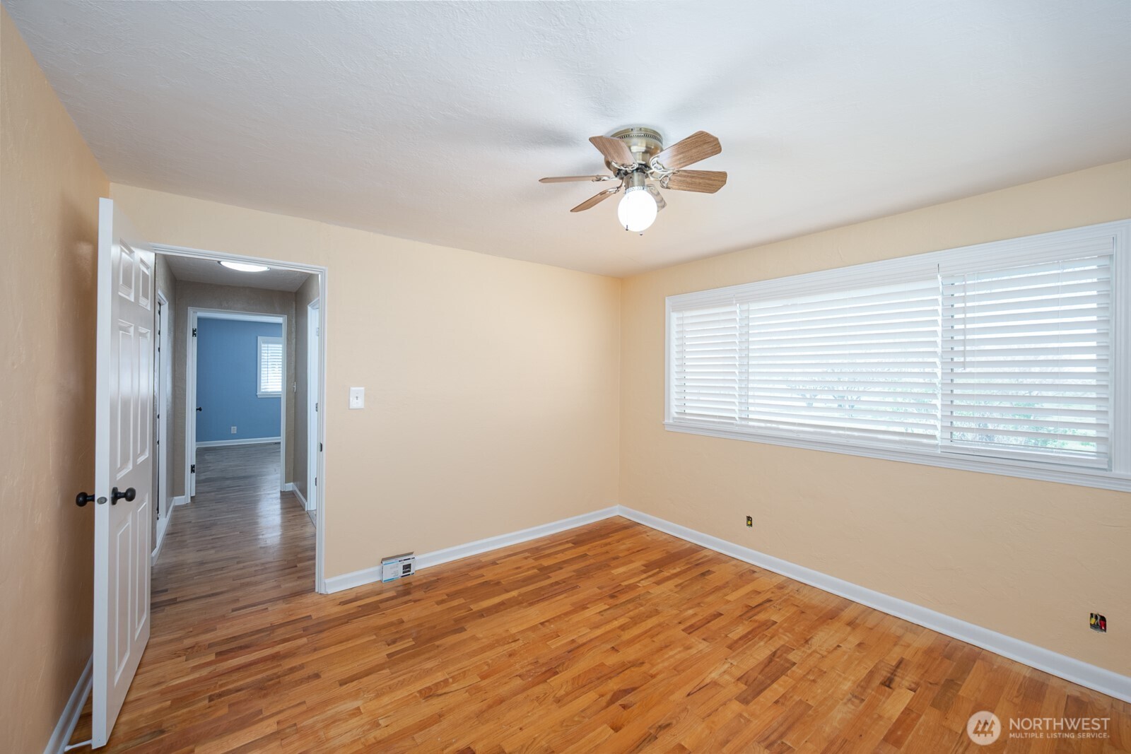 11627 Rd K Northeast Moses Lake, WA 98837 - Photo 23 of 37 a view of empty room with wooden floor and fan