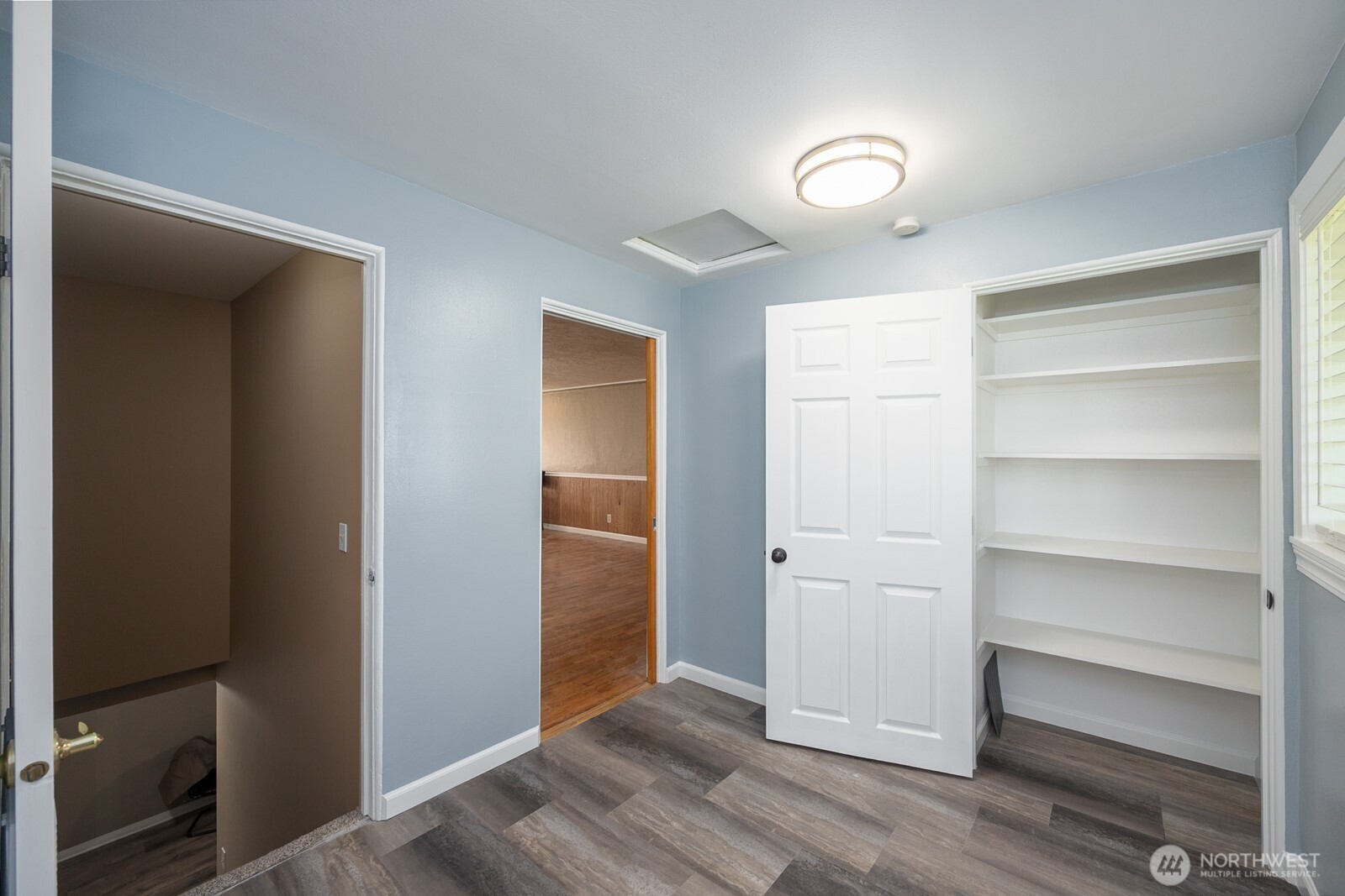 11627 Rd K Northeast Moses Lake, WA 98837 - Photo 24 of 37 a view of walk in closet with empty racks