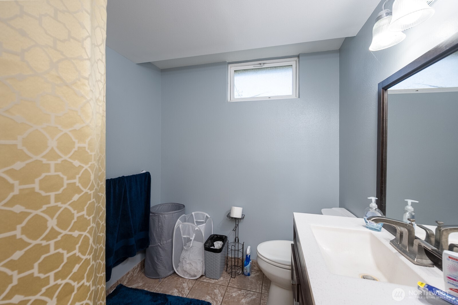 11627 Rd K Northeast Moses Lake, WA 98837 - Photo 29 of 37 a bathroom with a sink and a mirror