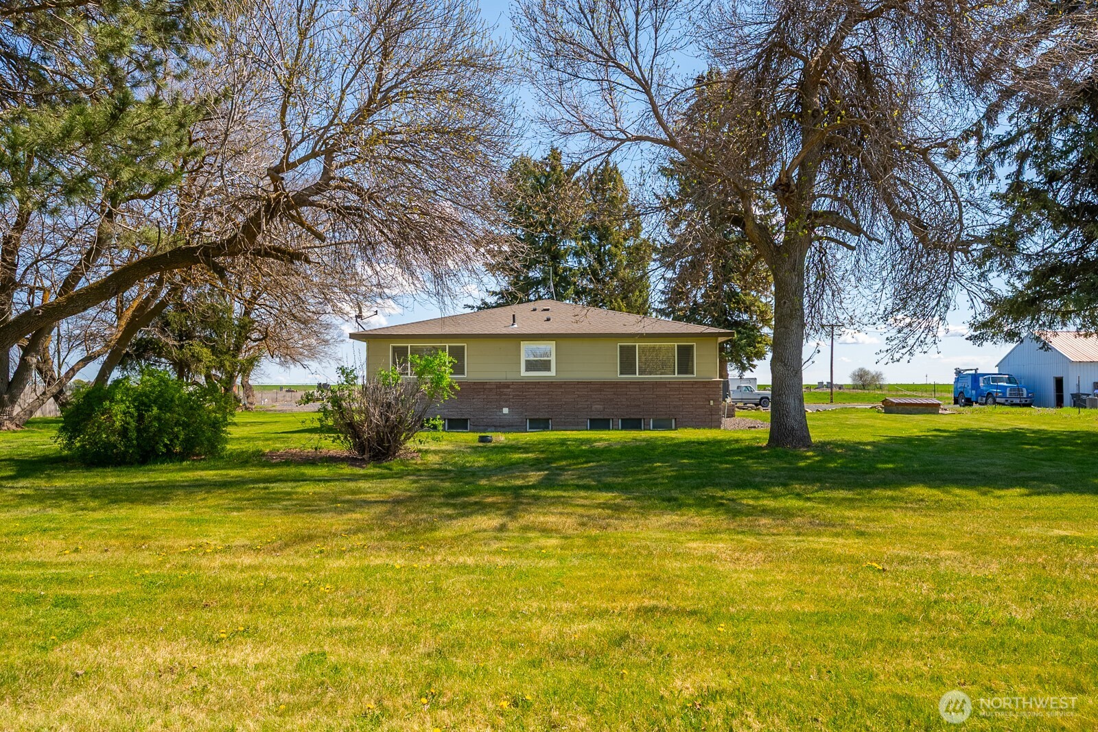 11627 Rd K Northeast Moses Lake, WA 98837 - Photo 6 of 37 a view of a house with a yard