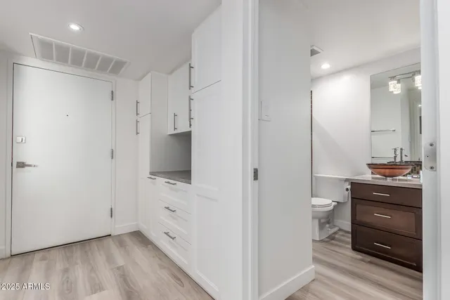 a bathroom with a shower and a sink