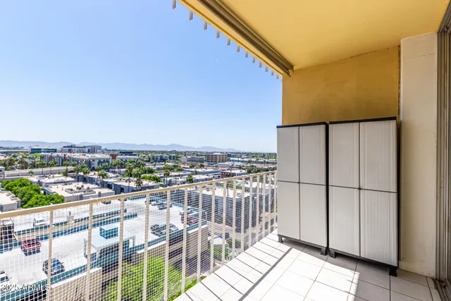 a view of balcony with two chairs and a table