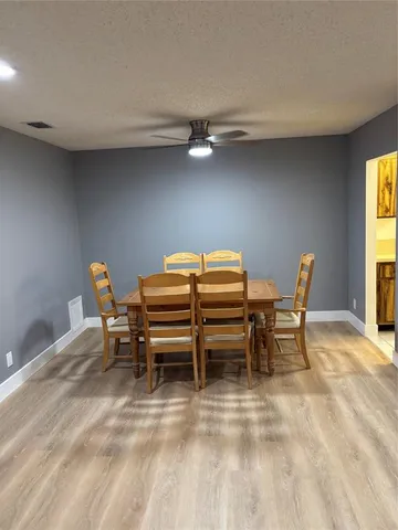 a reading room with furniture and a window