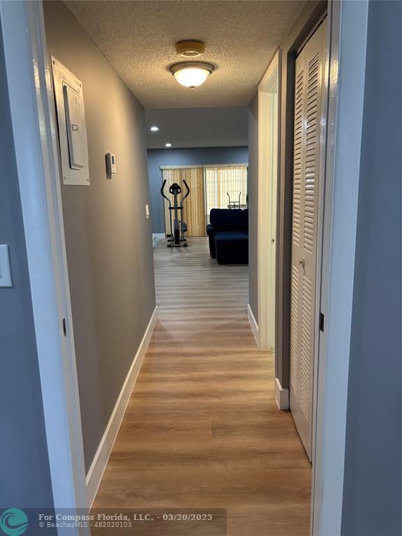 14748 Canalview Drive, Unit B Delray Beach, FL 33484 - Photo 8 of 12 a view of gallery with wooden floor