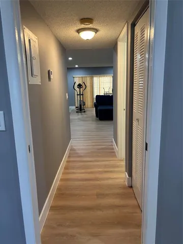 a view of gallery with wooden floor