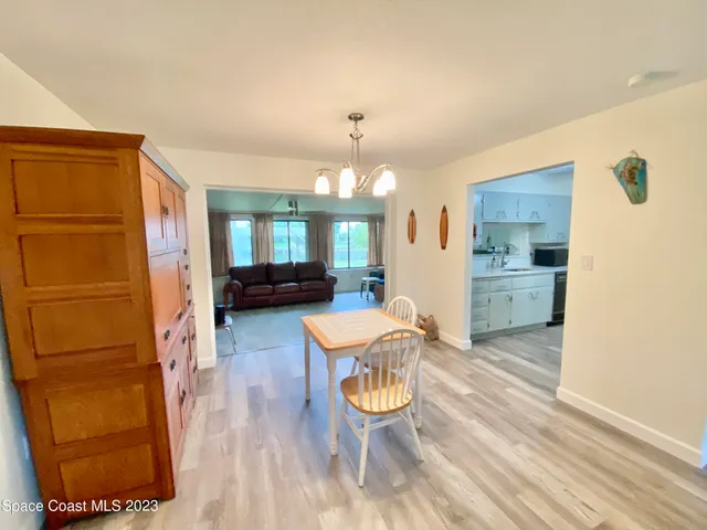 a view of a kitchen and dining room