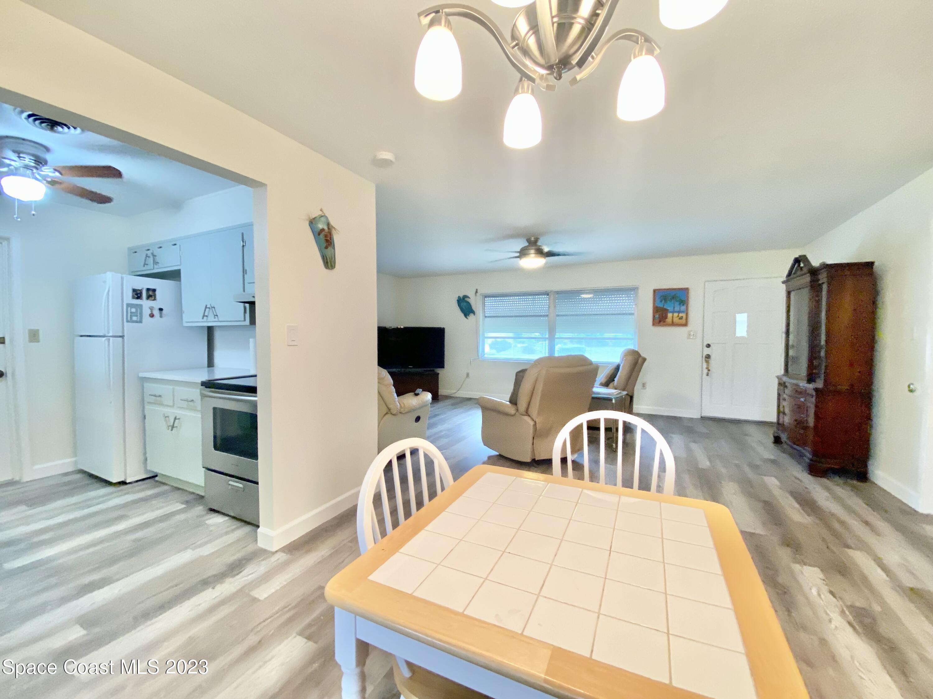 110 Deleon Road Cocoa Beach, FL 32931 - Photo 9 of 26 Dining Area to Kitchen