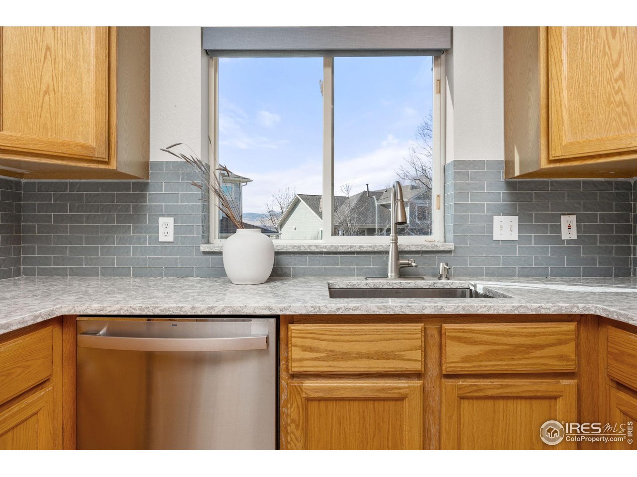 6644 Drew Ranch Lane Boulder, CO 80301 - Photo 13 of 45 a bathroom with a granite countertop sink and a window