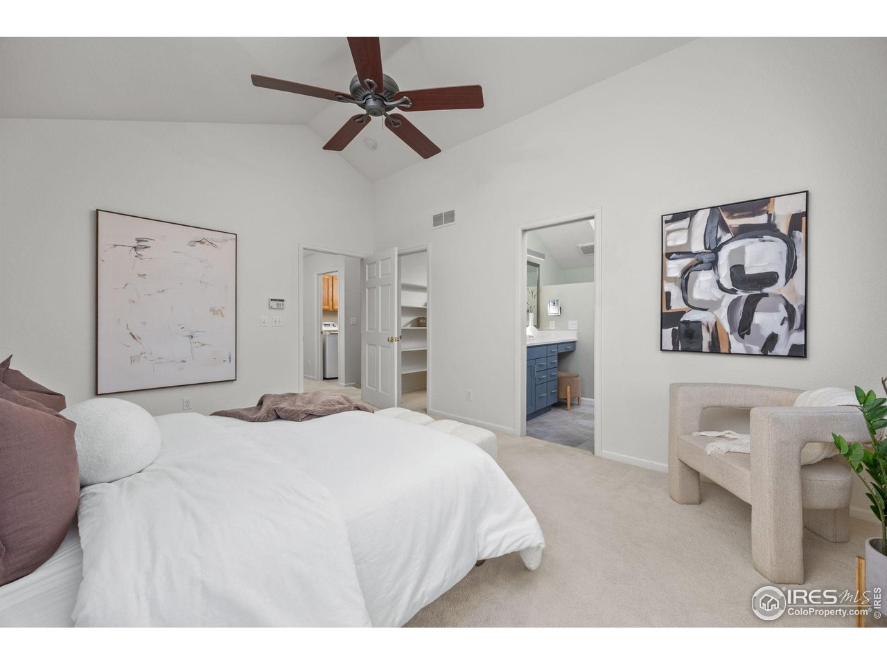 6644 Drew Ranch Lane Boulder, CO 80301 - Photo 18 of 45 a bedroom with a bed and a chandelier