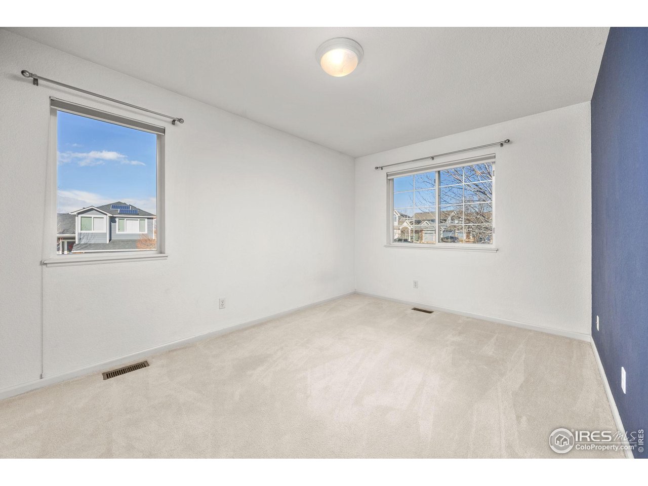 6644 Drew Ranch Lane Boulder, CO 80301 - Photo 22 of 45 a view of an empty room with a window