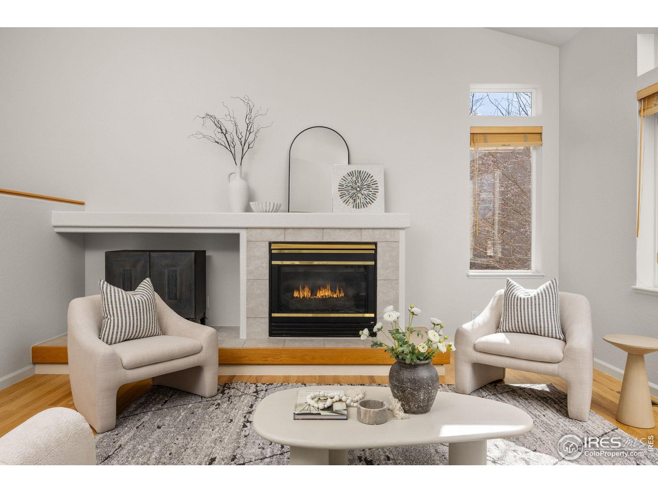 6644 Drew Ranch Lane Boulder, CO 80301 - Photo 7 of 45 a living room with furniture a rug and a fireplace