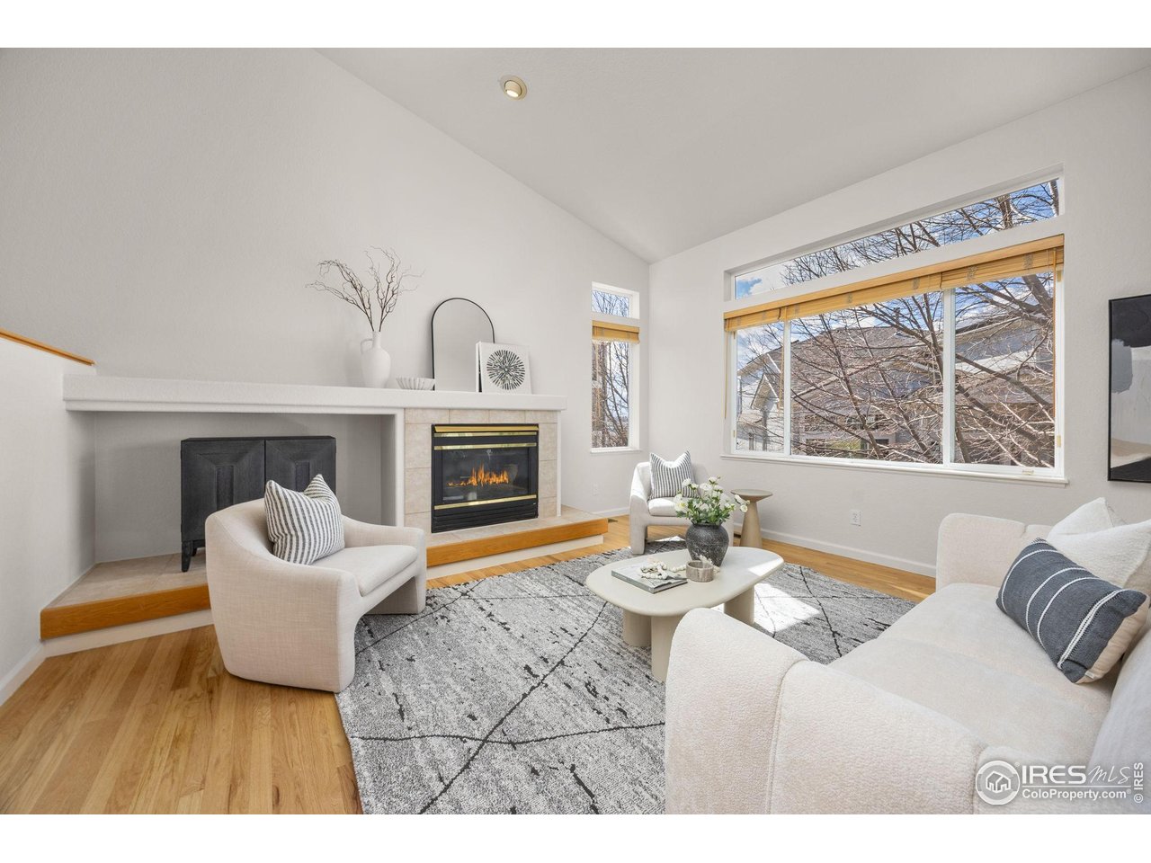 6644 Drew Ranch Lane Boulder, CO 80301 - Photo 8 of 45 a living room with furniture and a fireplace