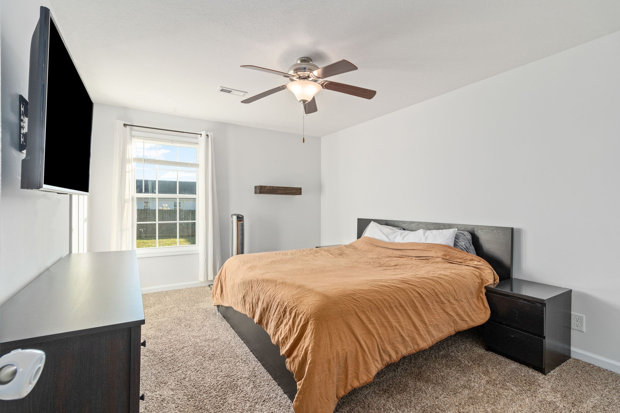 949 Hugh Hunter Road Oak Grove, KY 42262 - Photo 17 of 21 a bedroom with a bed and a window