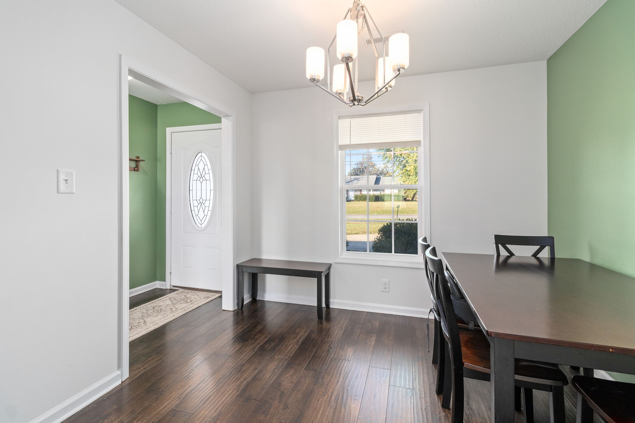 949 Hugh Hunter Road Oak Grove, KY 42262 - Photo 5 of 21 a view of a dining room with furniture a chandelier and wooden floor