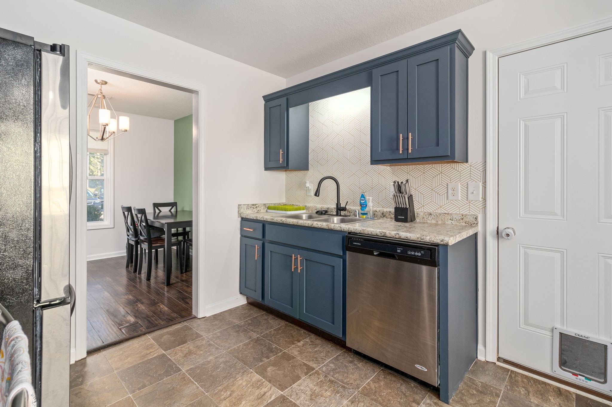 949 Hugh Hunter Road Oak Grove, KY 42262 - Photo 7 of 21 a kitchen with a sink and a refrigerator
