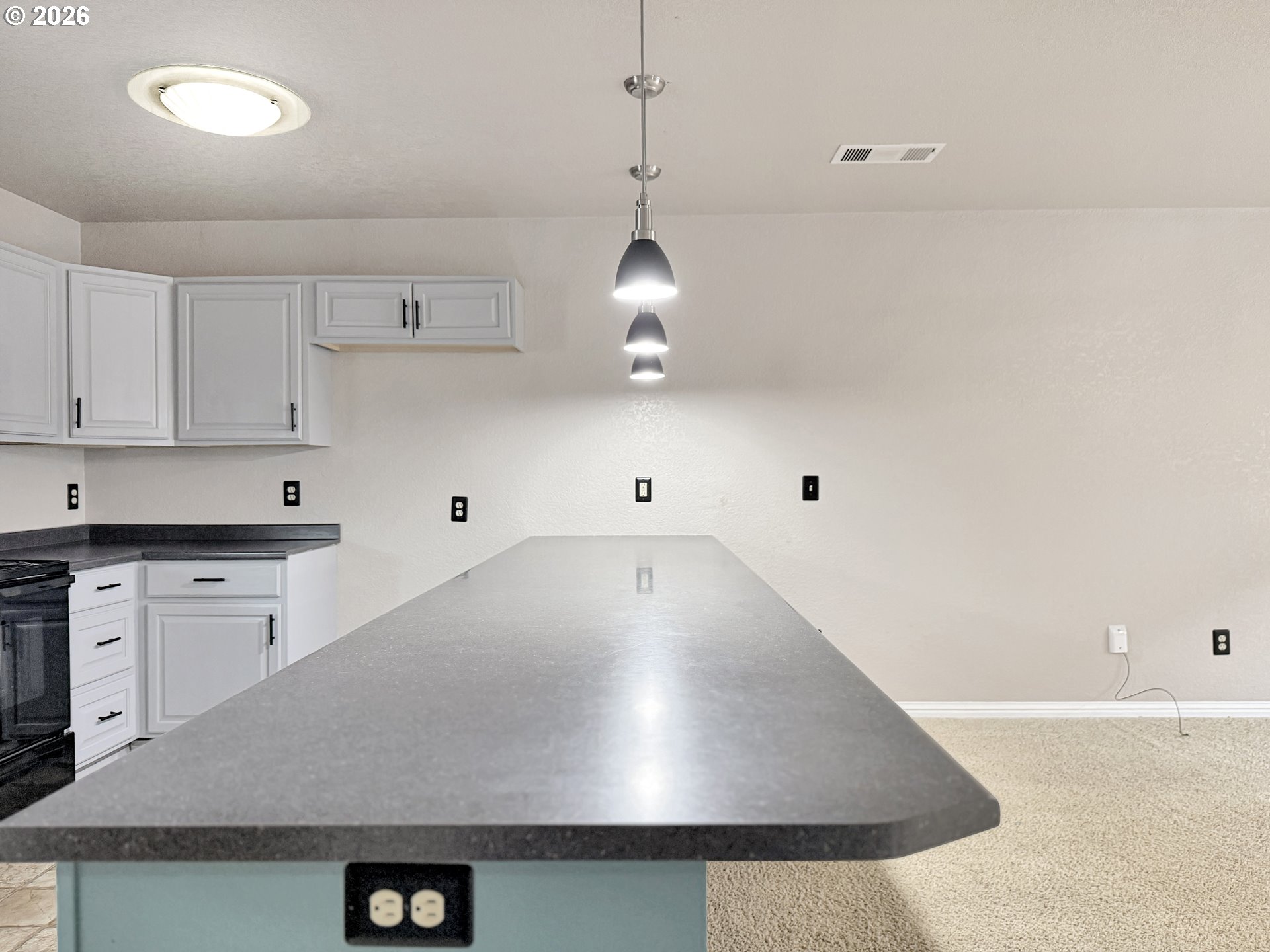 325 Matot Street, Unit B Brookings, OR 97415 - Photo 11 of 28 a view of a kitchen with a stove
