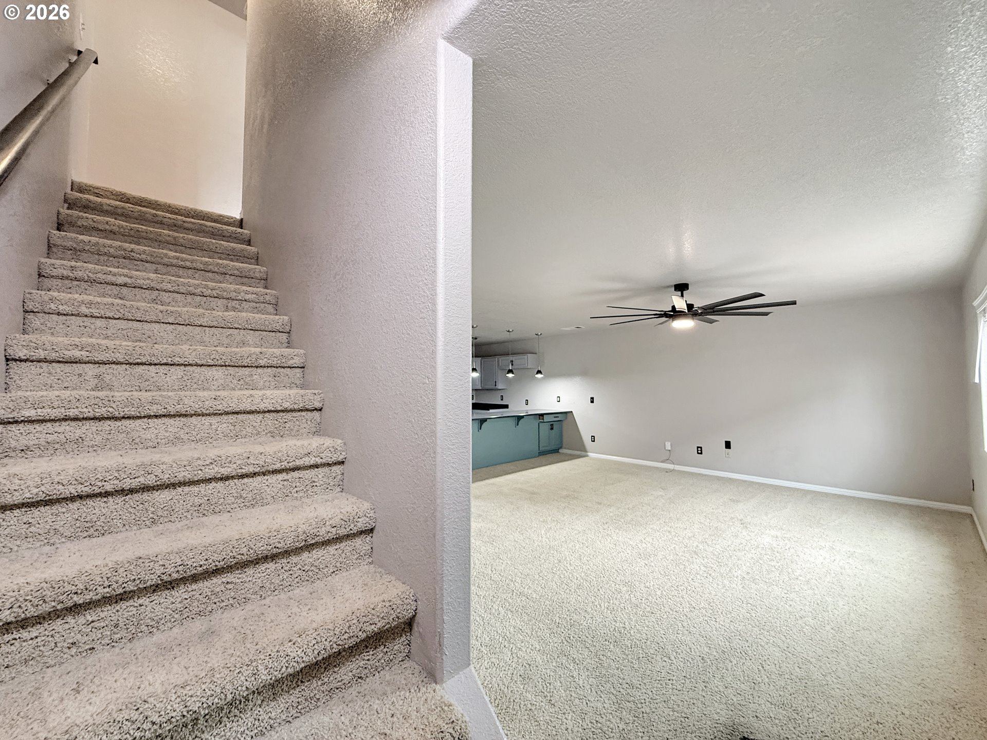 325 Matot Street, Unit B Brookings, OR 97415 - Photo 12 of 28 a view of a room with stairs and a chandelier
