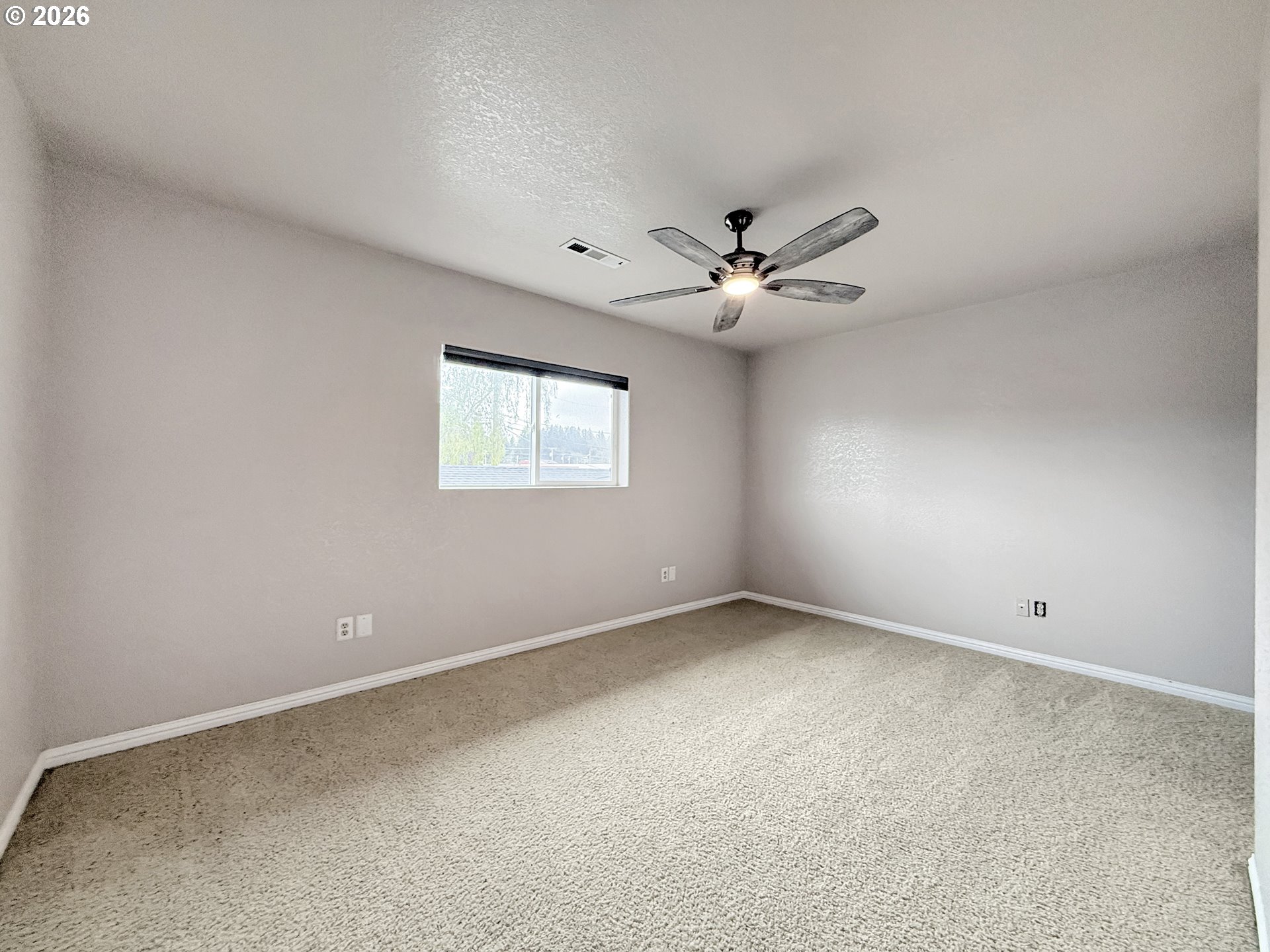 325 Matot Street, Unit B Brookings, OR 97415 - Photo 13 of 28 a view of an empty room with a window