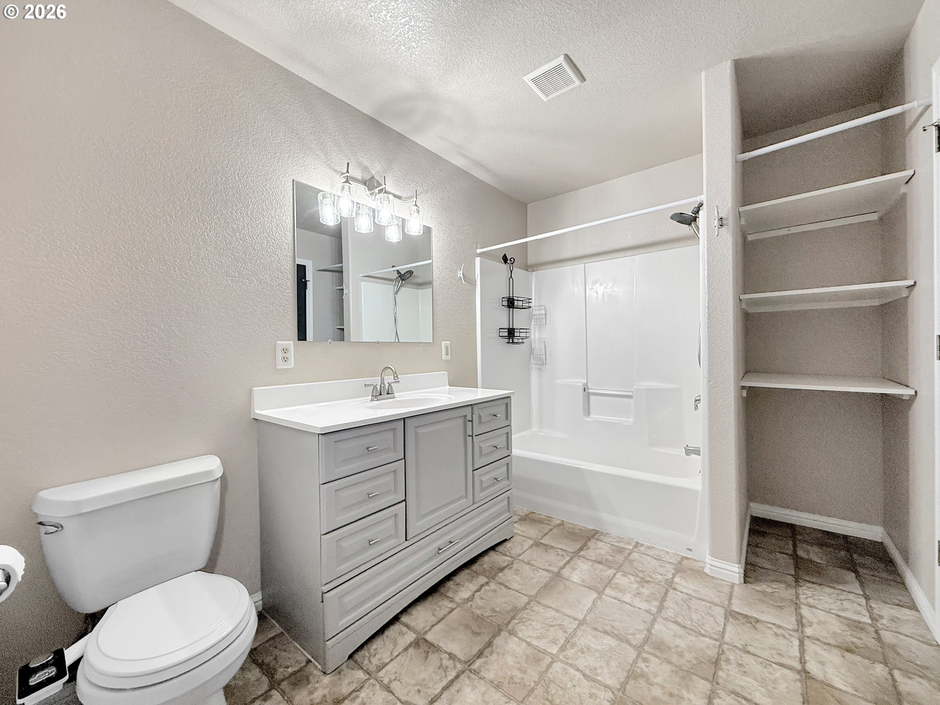 325 Matot Street, Unit B Brookings, OR 97415 - Photo 16 of 28 a bathroom with a sink a toilet and shower