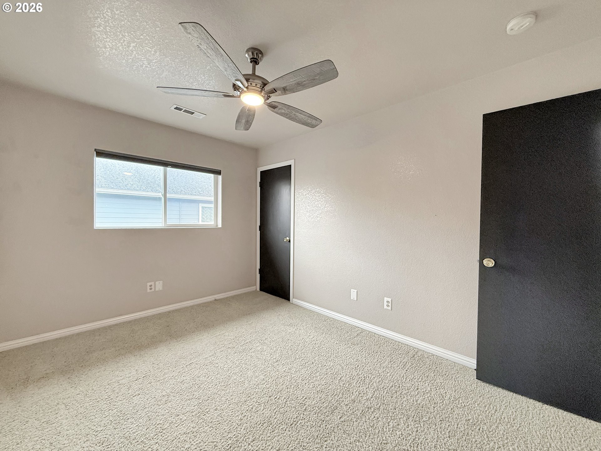 325 Matot Street, Unit B Brookings, OR 97415 - Photo 19 of 28 a view of an empty room with a window