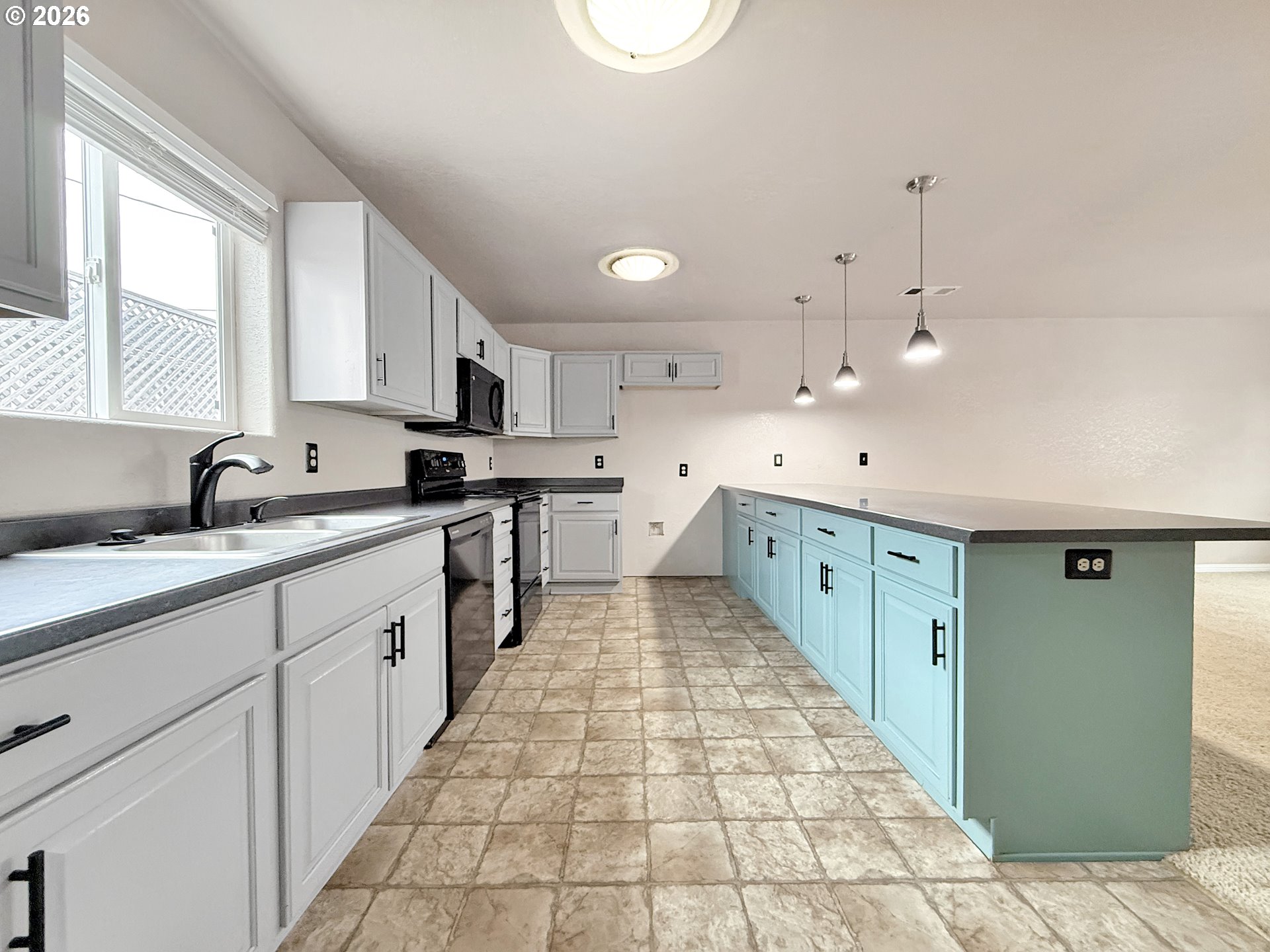 325 Matot Street, Unit B Brookings, OR 97415 - Photo 8 of 28 a large kitchen with stainless steel appliances lots of counter space sink and cabinets