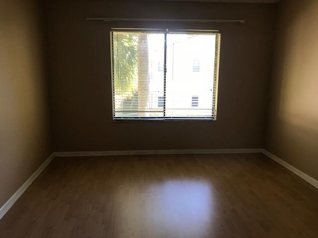 21950 Soundview Terrace, Unit 209 Boca Raton, FL 33433 - Photo 8 of 15 an empty room with a window