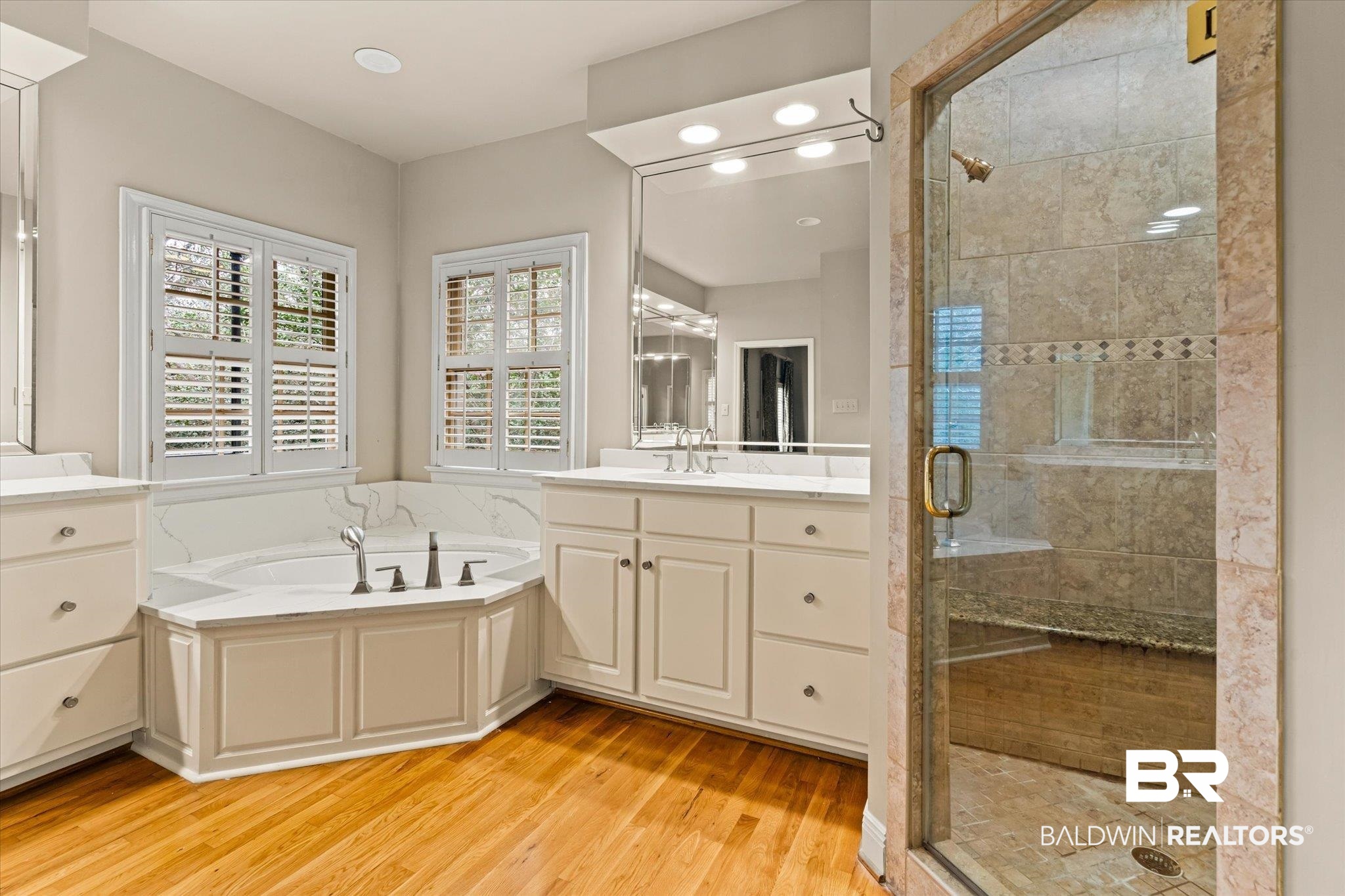 143 Myrtlewood Lane Mobile, AL 36608 - Photo 52 of 55 Full bathroom with vanity, a shower stall, a bath, and wood finished floors