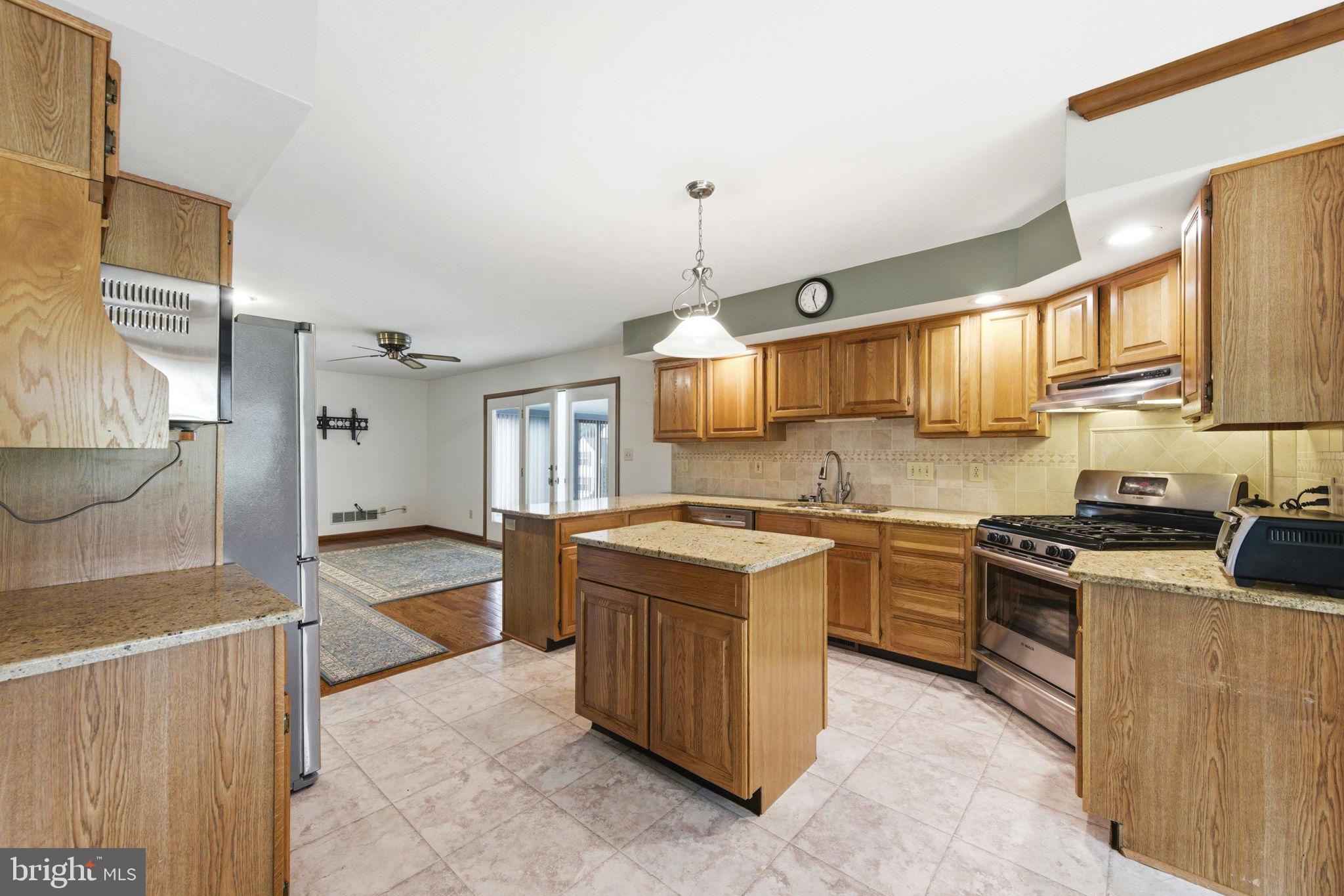 736 Letitia Drive Hockessin, DE 19707 - Photo 29 of 92 a kitchen with a stove top oven sink and cabinets