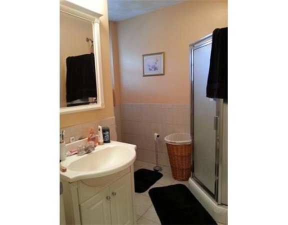 3 Gardner Street, Unit 2 Boston, MA 02132 - Photo 6 of 6 a bathroom with a sink and a mirror