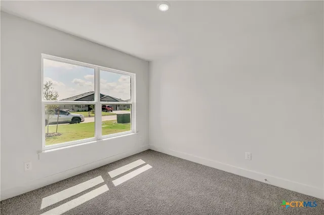 a bathroom with a granite countertop sink a toilet and bathtub