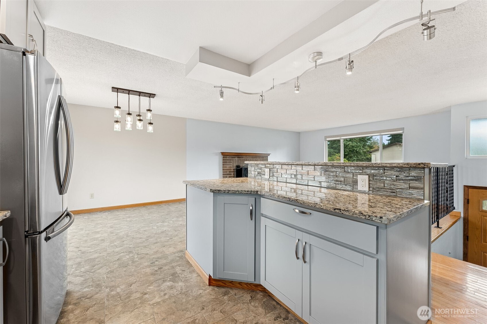 10014 108th Avenue Southwest Tacoma, WA 98498 - Photo 12 of 39 a kitchen with cabinets and stainless steel appliances