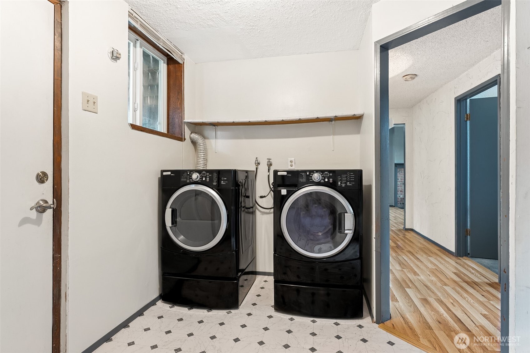 10014 108th Avenue Southwest Tacoma, WA 98498 - Photo 23 of 39 a bathroom with a sink and a washing machine