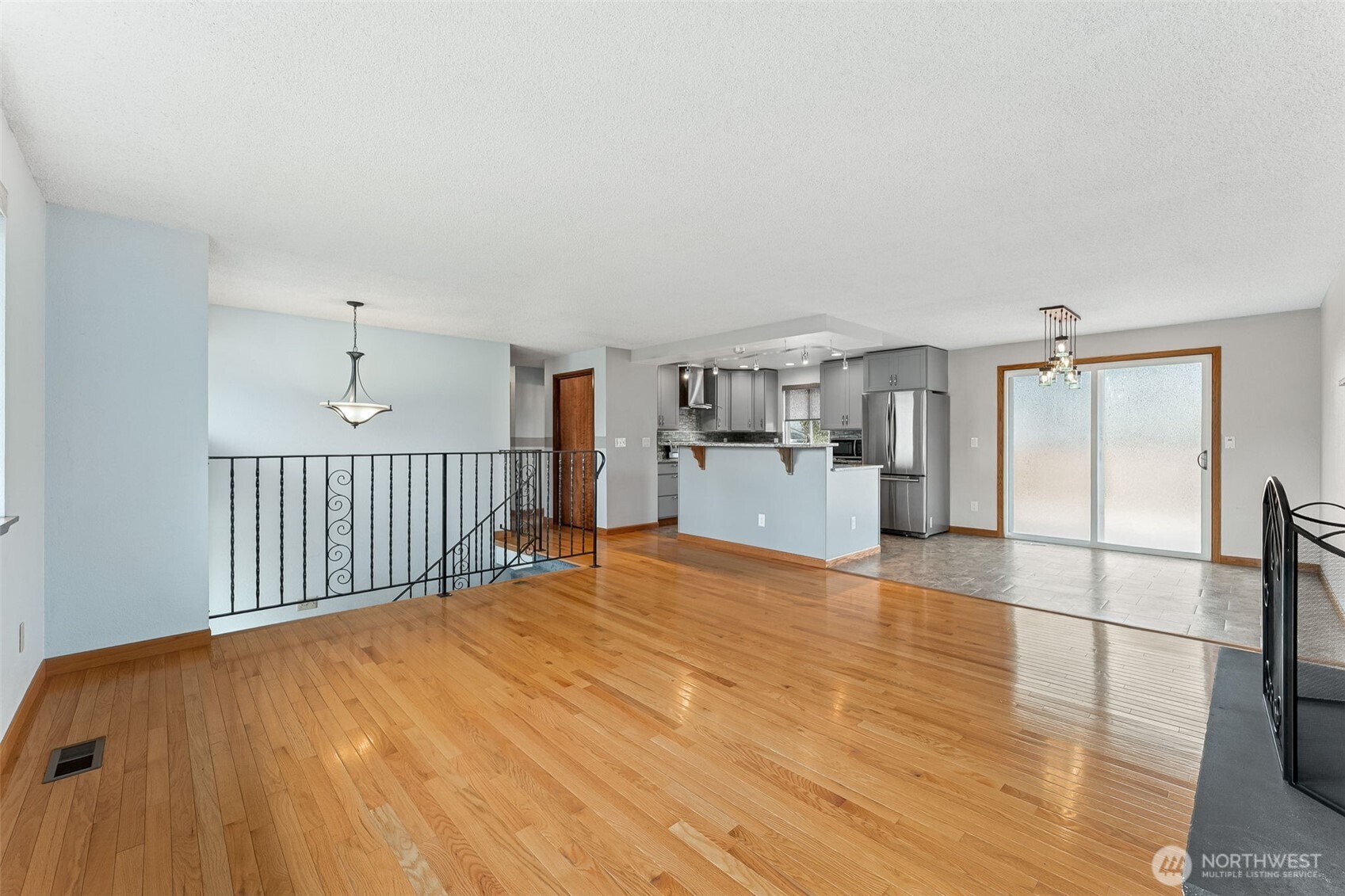 10014 108th Avenue Southwest Tacoma, WA 98498 - Photo 7 of 39 a view of a kitchen with a sink and a refrigerator