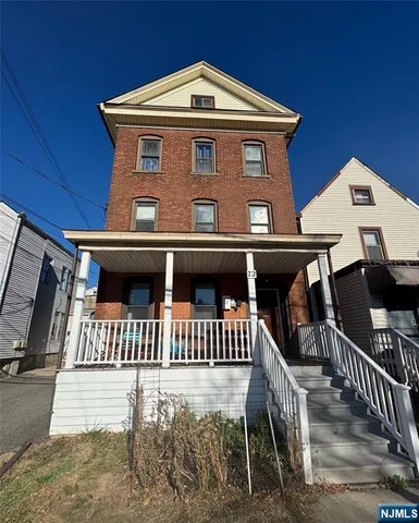 a front view of a house with deck