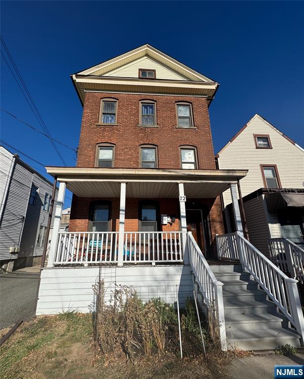 a front view of a house with deck