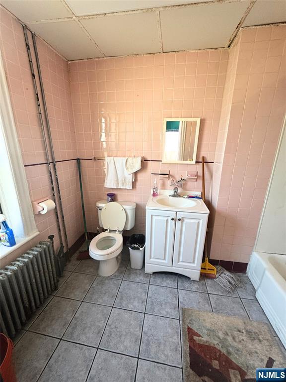 72 Lawrence Street Hackensack, NJ 07601 - Photo 2 of 11 a bathroom with a sink toilet and shower