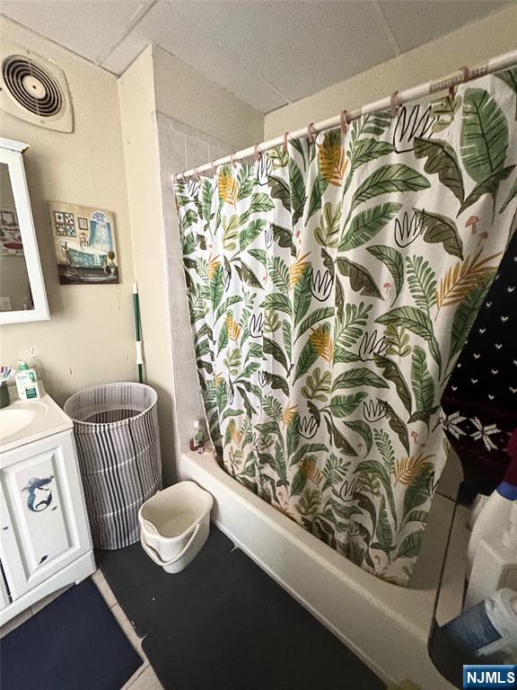 72 Lawrence Street Hackensack, NJ 07601 - Photo 7 of 11 a bathroom with a sink and a mirror