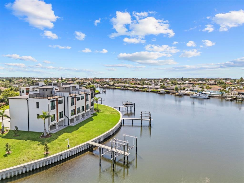 775 Gran Kaymen Way Apollo Beach, FL 33572 - Photo 2 of 43 a view of a chairs and table in the terrace