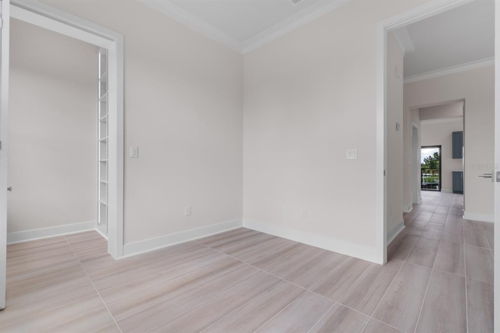 775 Gran Kaymen Way Apollo Beach, FL 33572 - Photo 27 of 43 a view of a room with wooden floor