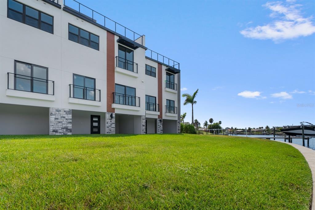 775 Gran Kaymen Way Apollo Beach, FL 33572 - Photo 40 of 43 a view of a building with a yard